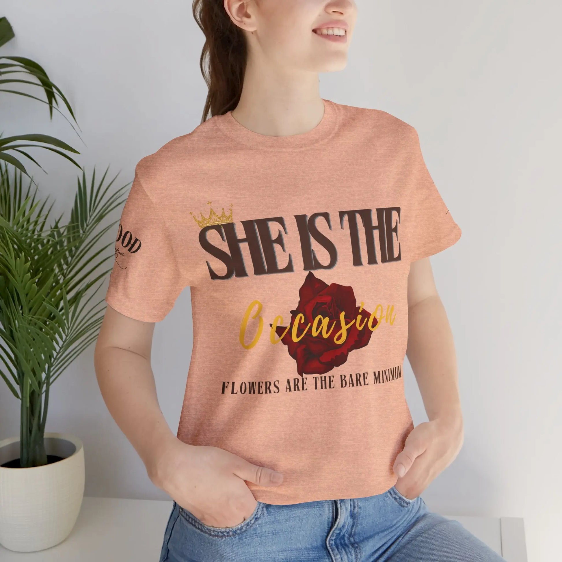 Pink "She Is The Occasion" women's statement T-shirt by Printify featuring empowering self-love message and soft girl luxury aesthetic.
