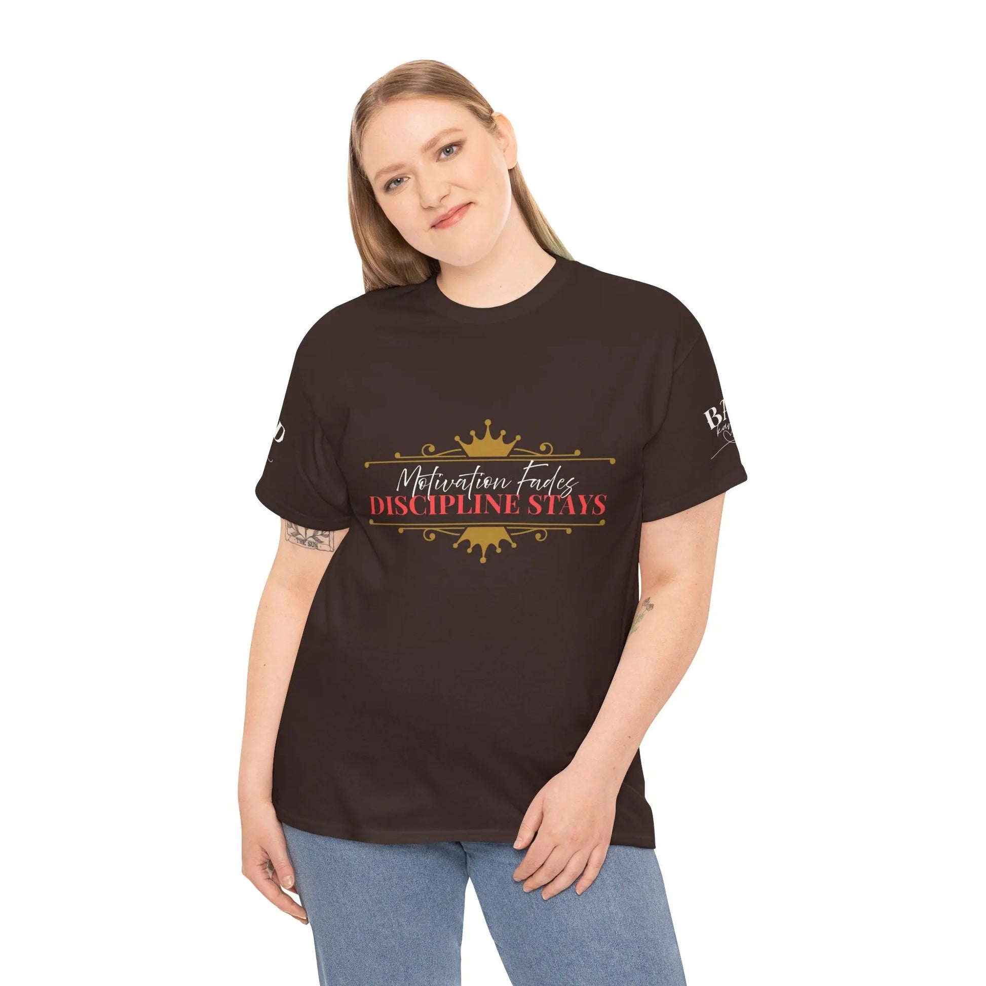 Women’s motivational graphic T-shirt with the phrase "Motivation Fades. Discipline Stays." in bold lettering, featuring empowering design.