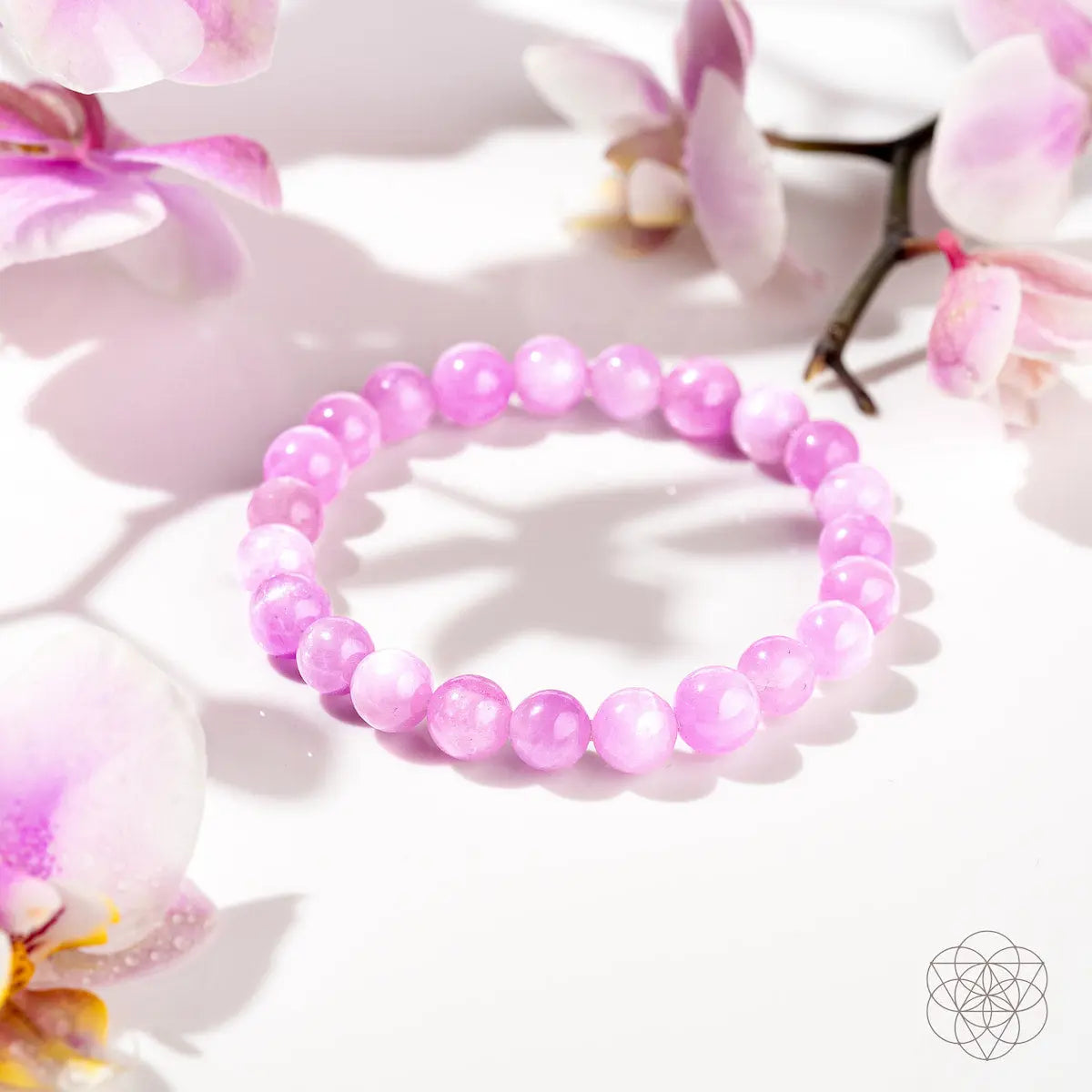 Pink Kunzite bracelet featuring heart-shaped beads from Conscious Items, showcasing delicate pink gemstones on a jewelry strand.