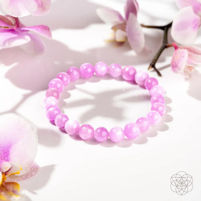 Pink Kunzite bracelet featuring heart-shaped beads from Conscious Items, showcasing delicate pink gemstones on a jewelry strand.