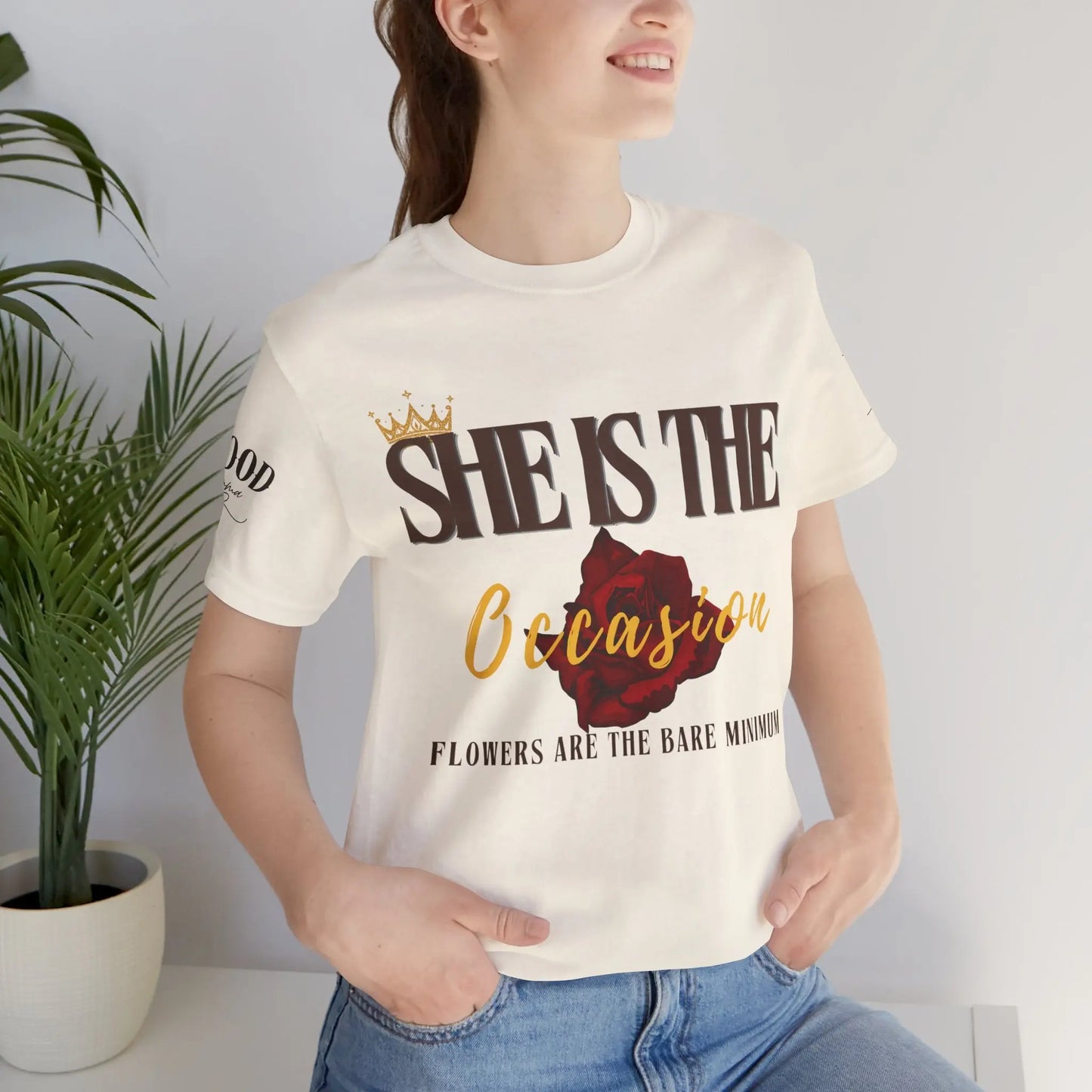 Soft pink "She Is The Occasion" women's motivational statement T-shirt by Printify, featuring empowering self-love message.