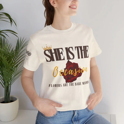 Soft pink "She Is The Occasion" women's motivational statement T-shirt by Printify, featuring empowering self-love message.