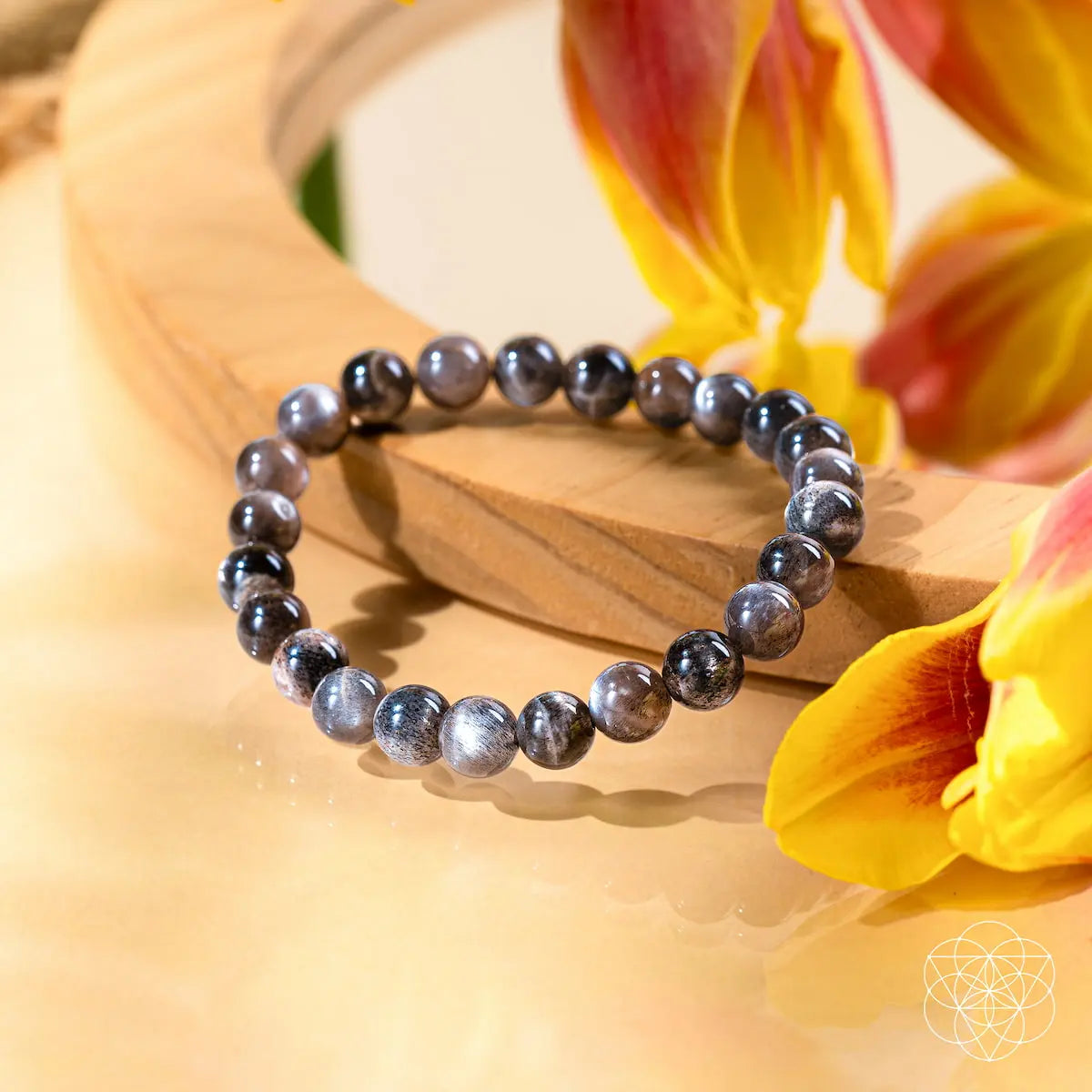 Black moonstone bracelet from The Empath’s Cord Cutter collection by Conscious Items, featuring smooth, polished stones and a sleek design.