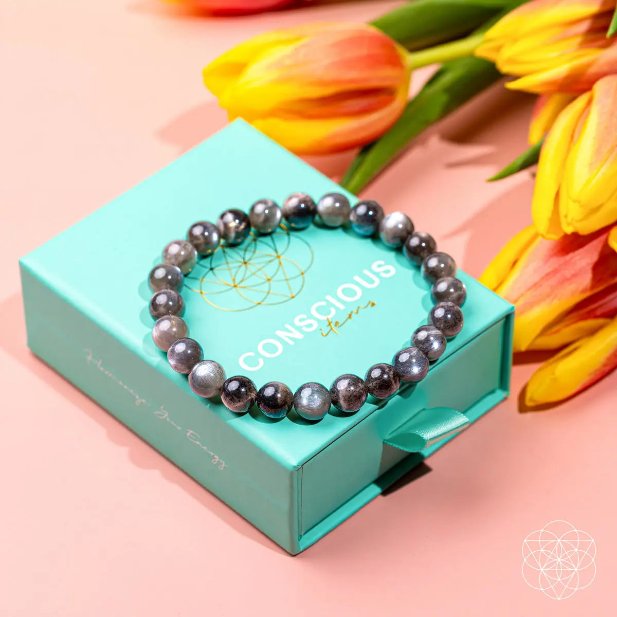 Black moonstone bracelet by Conscious Items, The Empath’s Cord Cutter, featuring smooth, polished stones on a stylish bracelet.