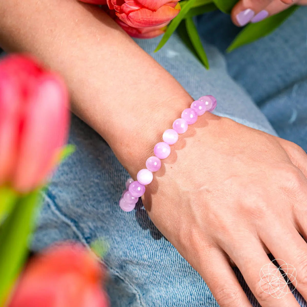 Pink Kunzite bracelet from Conscious Items featuring a delicate, polished design with vibrant pink stones and silver accents.