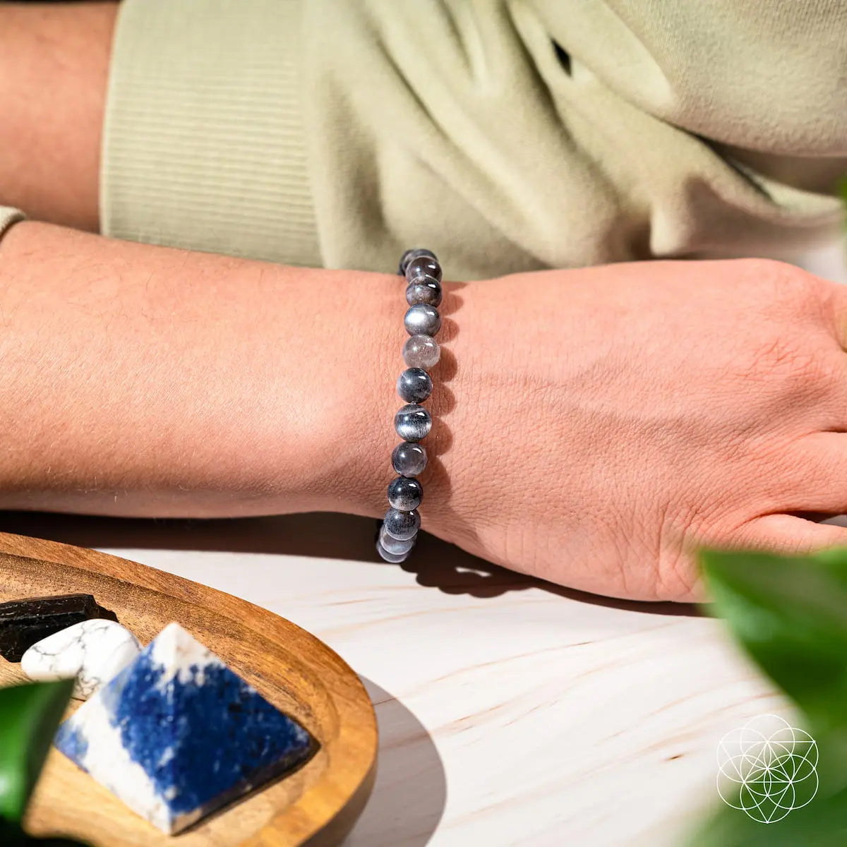 Black moonstone bracelet by Conscious Items featuring the Empath’s Cord Cutter design, showcasing smooth, polished stones on a delicate cord.