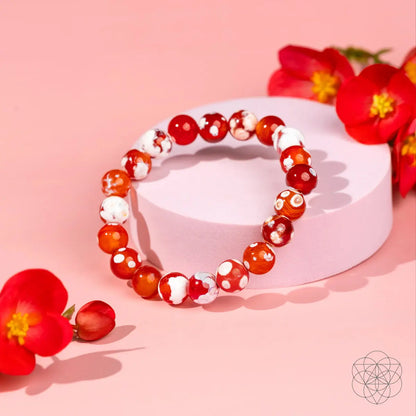 Feminine Force Carnelian Orca Agate bracelet by Conscious Items featuring orange and black patterned stone beads.