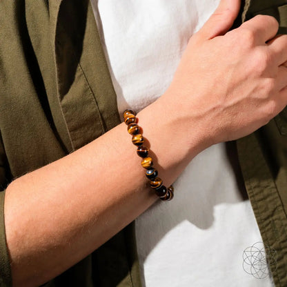 Conscious Items Tiger’s Eye bracelet featuring polished 7A grade tiger’s eye beads on an elastic cord, designed for style and energy.