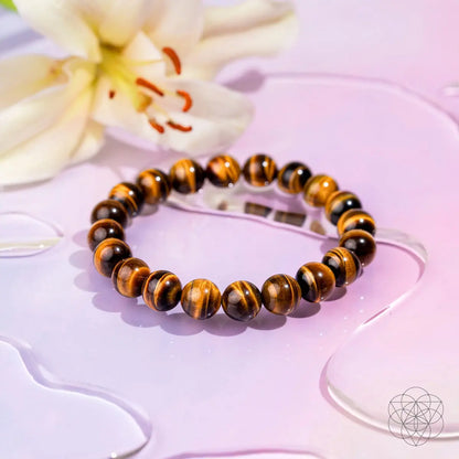 Conscious Items built to win 7A grade tiger’s eye bracelet showcasing polished tiger’s eye beads on a stretch cord.
