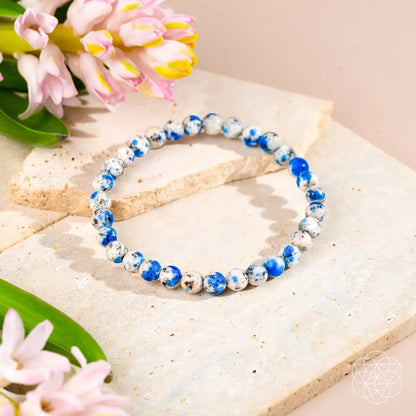 Close-up of a 6mm K2 Stone bracelet from Conscious Items, featuring smooth, round stones with a natural, earthy appearance.