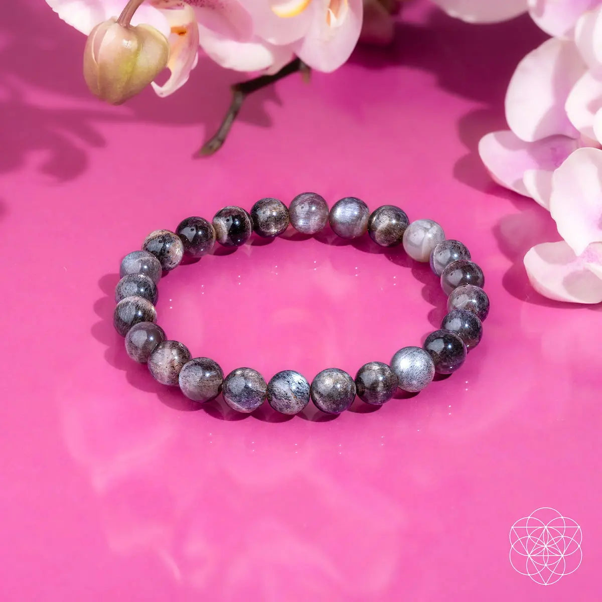 Black moonstone bracelet from Conscious Items' The Empath’s Cord Cutter collection, featuring smooth, polished stones and a stylish design.