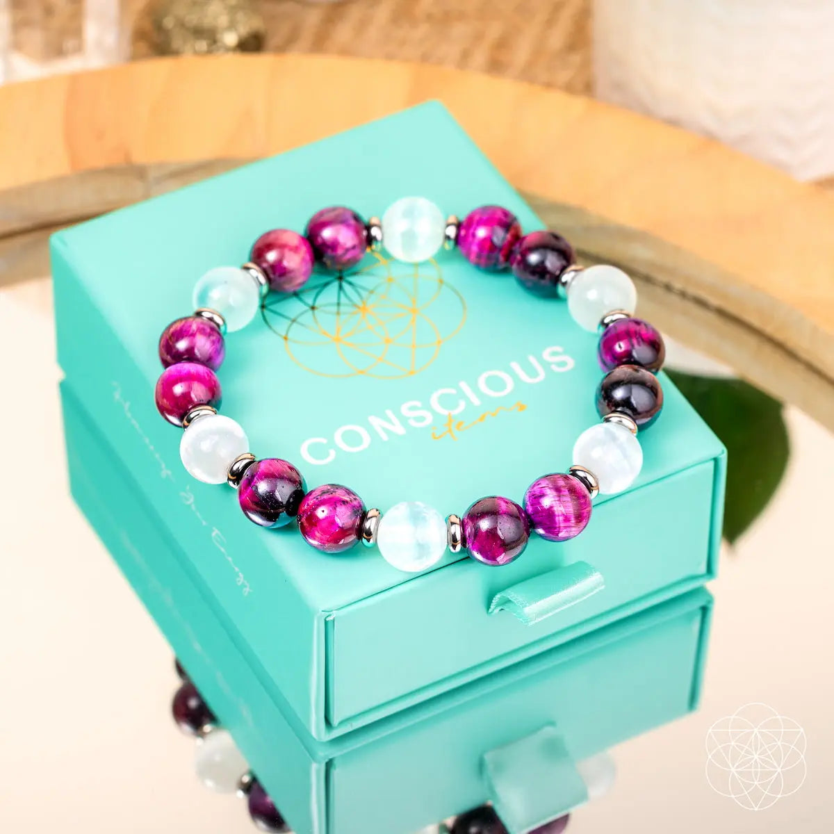 Pink Galaxy Tiger’s Eye bracelet from Conscious Items featuring pink and tiger’s eye beads on a stylish bracelet design.