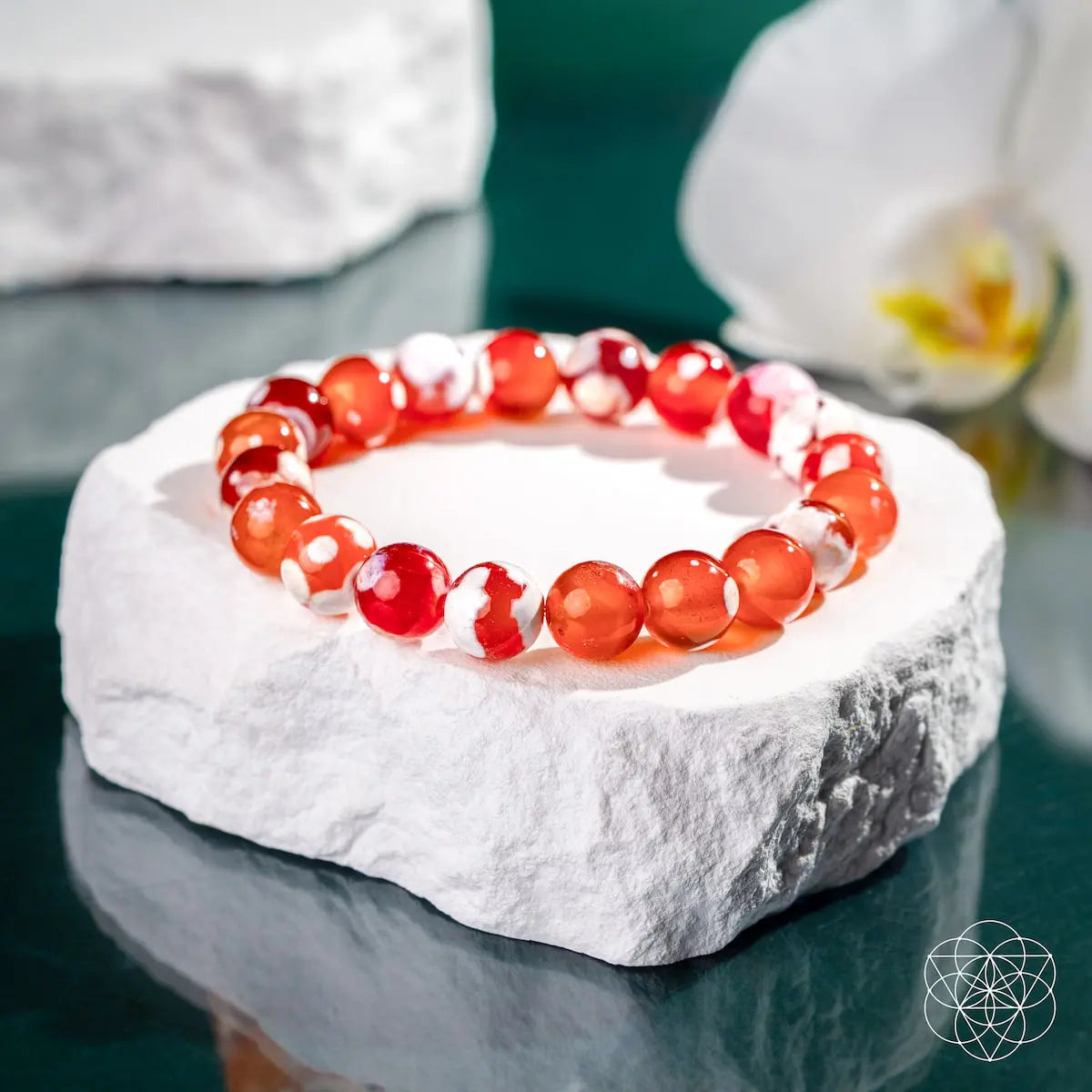 Feminine Force Carnelian Orca Agate bracelet from Conscious Items featuring vibrant orange and black patterned stones.