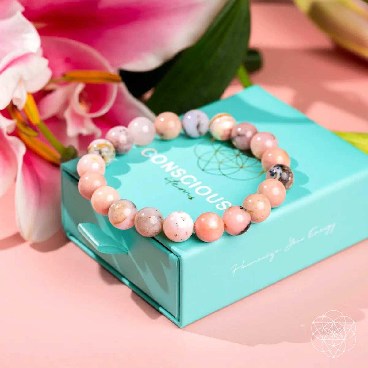Peruvian pink opal bracelet from Conscious Items featuring polished pink stone beads on an elastic band.