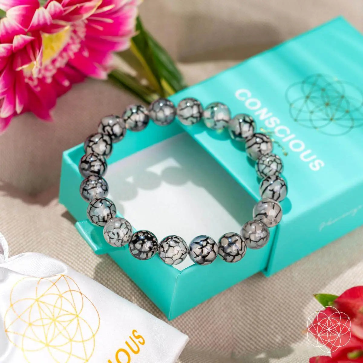River agate bracelet from Conscious Items, Calm in the Chaos collection, featuring smooth, polished stones on a flexible band.