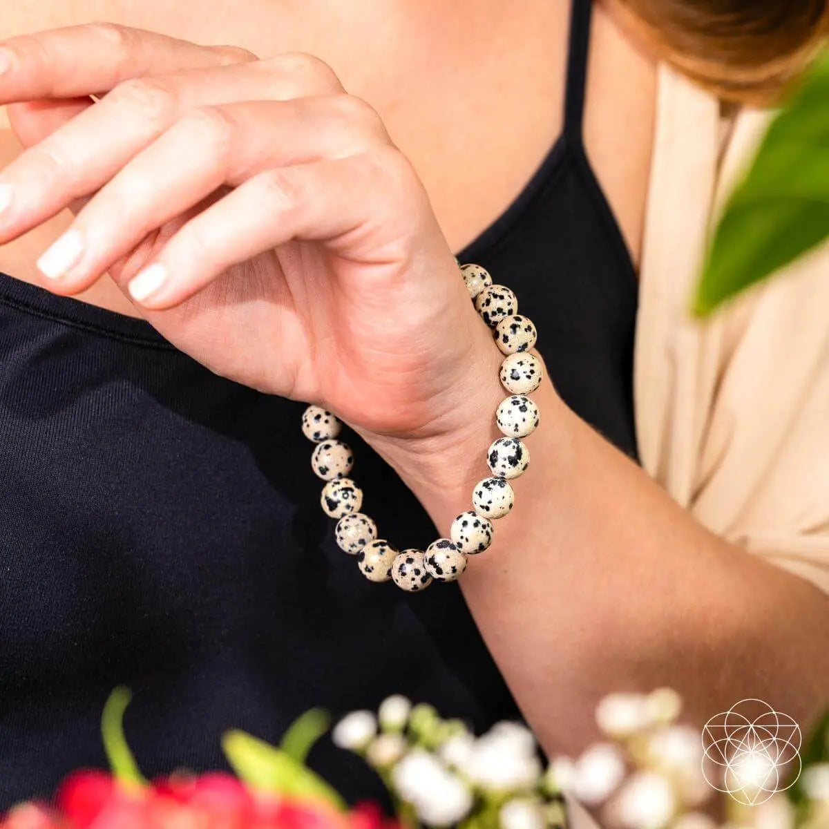 Dalmatian Jasper bracelet from Conscious Items featuring round beads and a natural, earthy appearance.