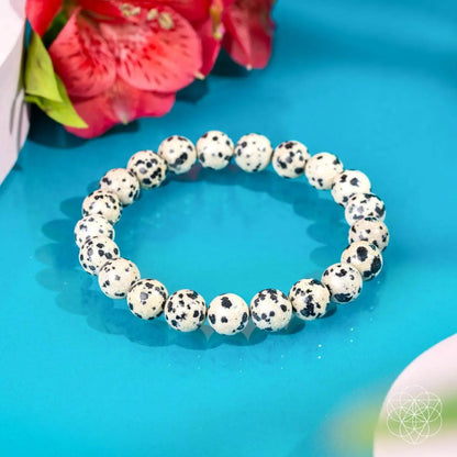 Dalmatian Jasper bracelet from Conscious Items featuring black and cream spotted stones, designed for emotional detox and healing.