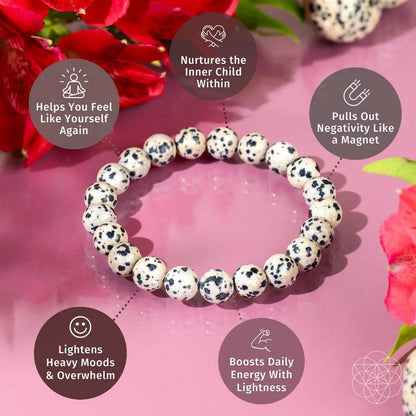 Dalmatian Jasper bracelet from Conscious Items featuring a string of round, spotted stone beads for emotional detox and healing.