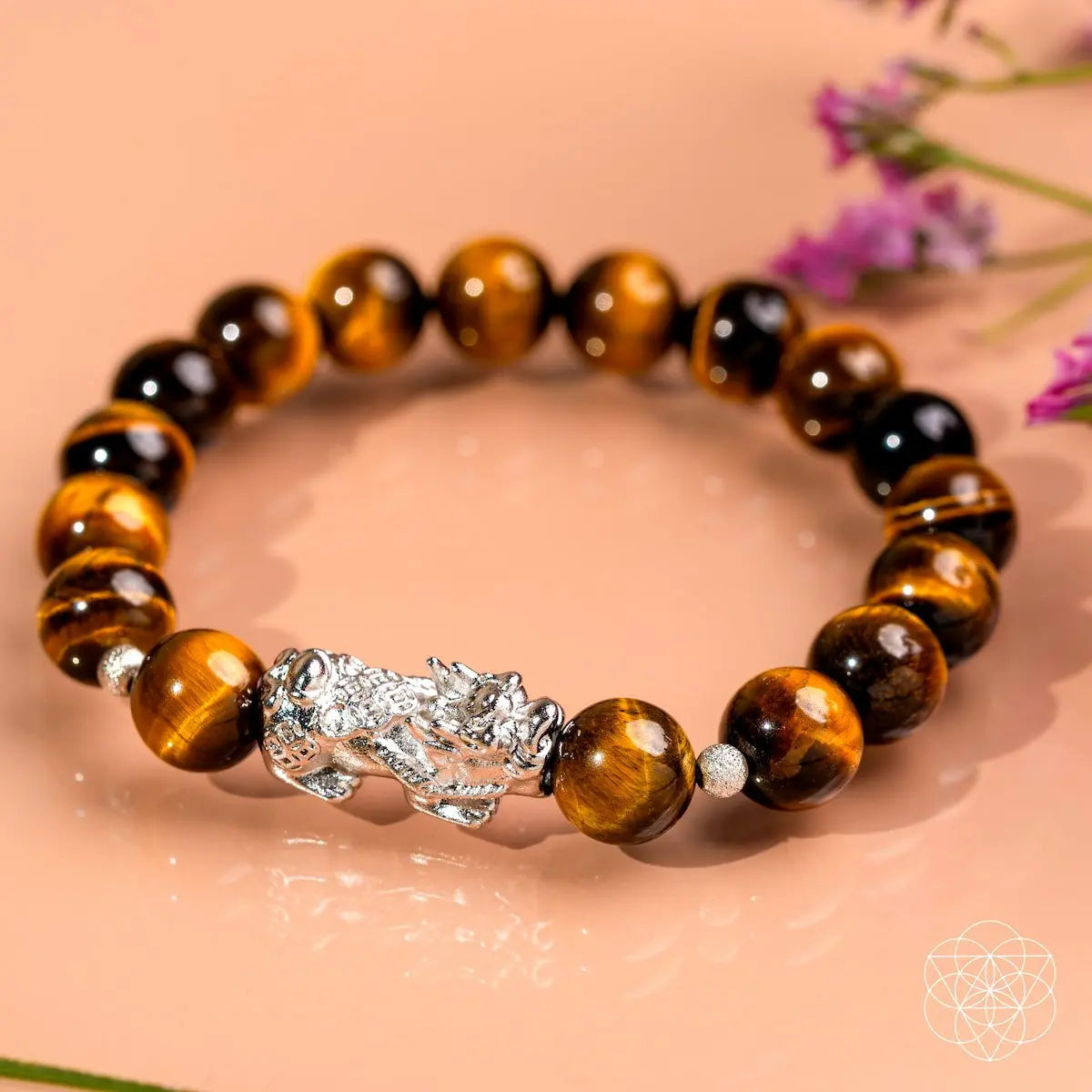 Tiger’s Eye and Pixiu bracelet from Fortune Flows by Conscious Items, featuring polished beads and intricate charm details.