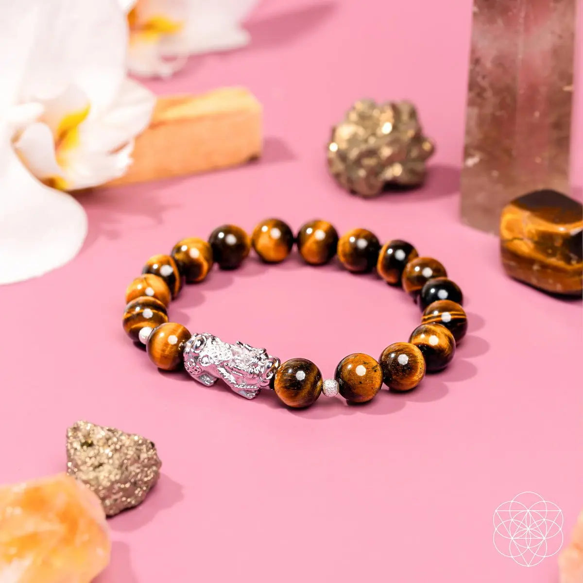 Tiger’s Eye and Pixiu bracelet from Conscious Items featuring a beaded design and intricate charm for good luck.