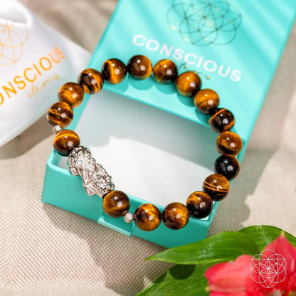 Tiger’s Eye and Pixiu bracelet from Conscious Items featuring natural stones and intricate design for positive energy and style.