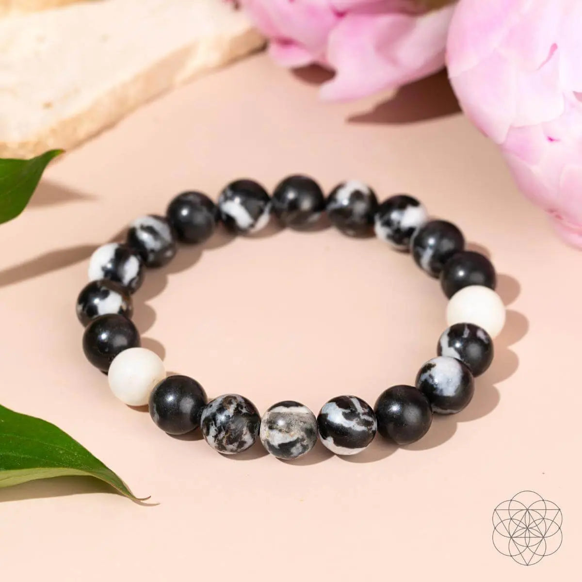Zebra Jasper bracelet by Conscious Items featuring natural black and white striped stones on a stretchy cord.