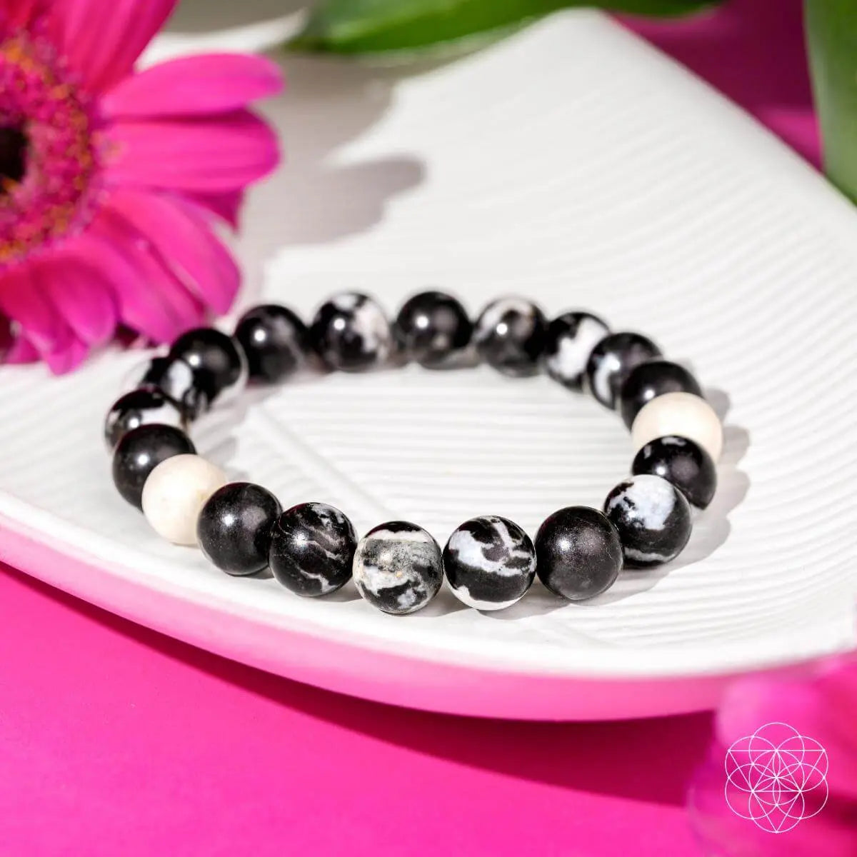 Zebra Jasper bracelet by Conscious Items featuring black and white striped beads on an elastic cord, designed for stylish wear.