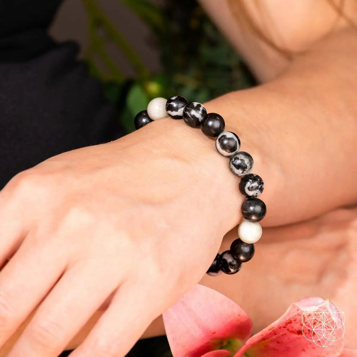 Zebra Jasper bracelet from Conscious Items featuring black and white striped beads, designed for stylish, natural gemstone jewelry.