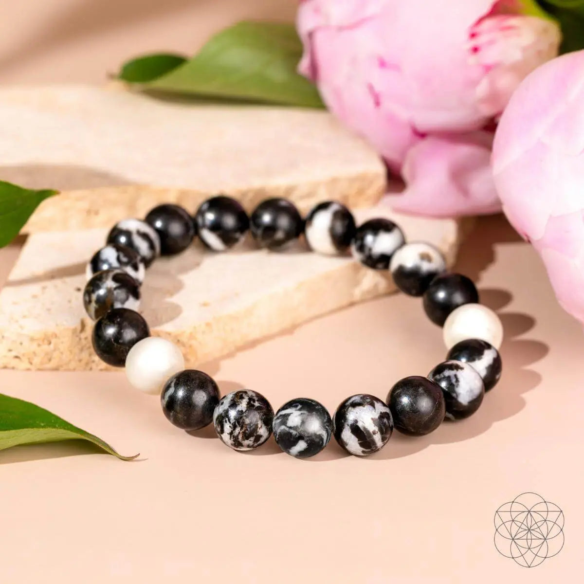 Zebra Jasper bracelet from Conscious Items featuring black and white striped beads on a stretch cord design.
